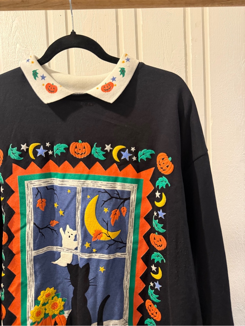 Black Women's Crewneck Sweater with Halloween Window Graphic